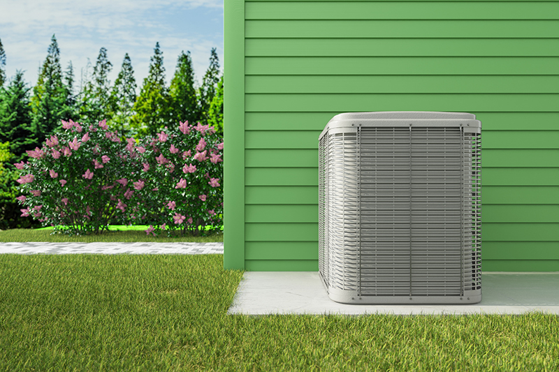 Heat Pump System Installed on Modern Building Exterior.