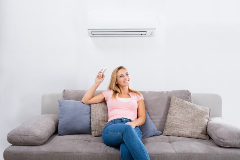 Blond Woman Enjoying Ductless Air Conditioner