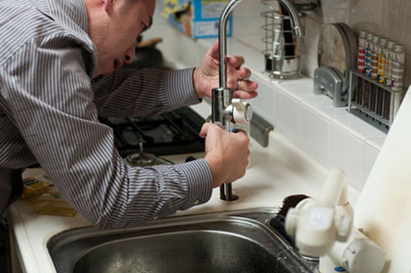 Male Plumber Working